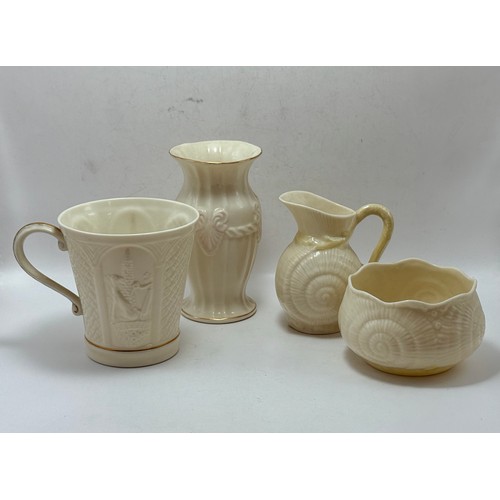  Four pieces of Belleek pottery - Neptune Shell Sugar Bowl and Milk Jug, Sea Shell pink and Cream vas... 