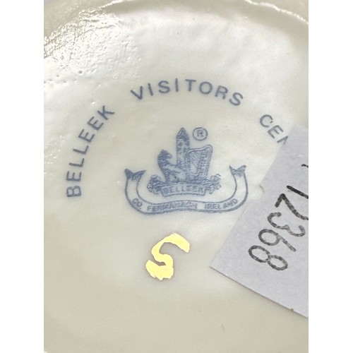 Four pieces of Belleek pottery - Neptune Shell Sugar Bowl and Milk Jug, Sea Shell pink and Cream vas... 