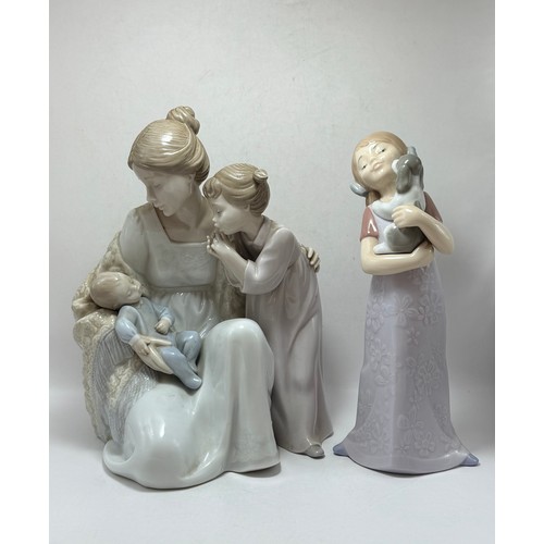  A Lladro and Nao Figurine - 'welcome to the Family' with box H24cm x W18cm plus 'Puppy Cuddles' H22c... 