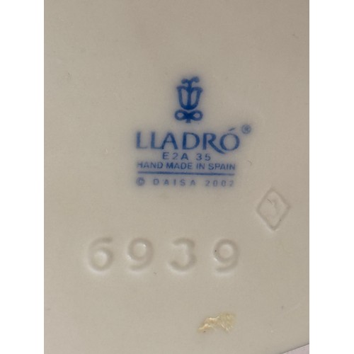  A Lladro and Nao Figurine - 'welcome to the Family' with box H24cm x W18cm plus 'Puppy Cuddles' H22c... 