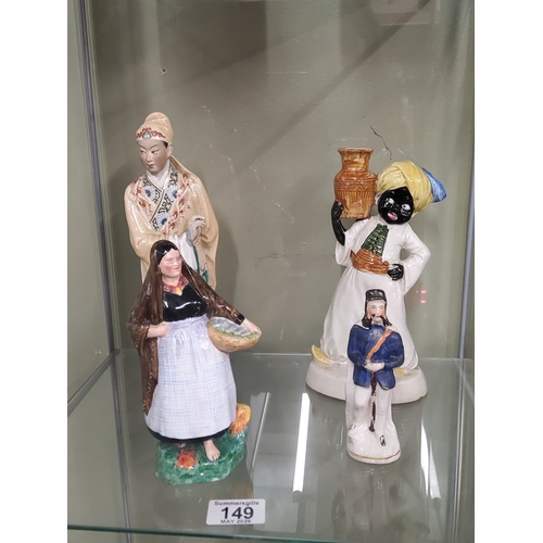 149 - Four ceramic figurines including Royal Doulton Lough Neagh Mary, vintage blackamoor figure, Stafford... 