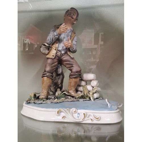 203 - A collection of three Capodimonte figurines