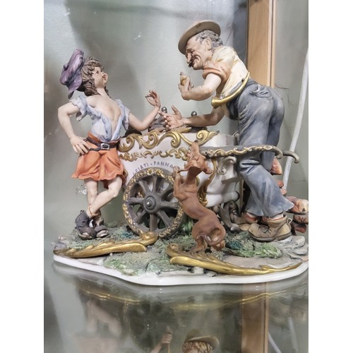 203 - A collection of three Capodimonte figurines