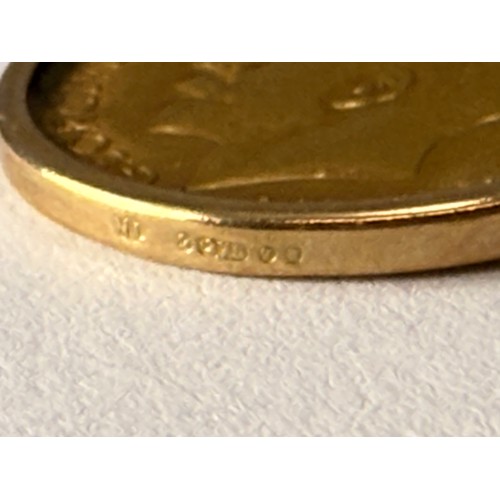  A George V half sovereign, 1915, loose-mounted to a 9 carat gold pendant mount hallmarked London 197... 