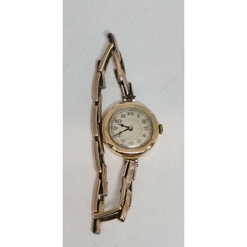 537 - Two 9 carat gold expanding bracelet wristwatches, circular, the first with black Arabic numerals and... 