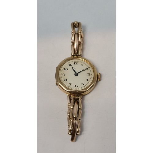 537 - Two 9 carat gold expanding bracelet wristwatches, circular, the first with black Arabic numerals and... 