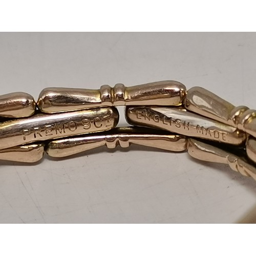 537 - Two 9 carat gold expanding bracelet wristwatches, circular, the first with black Arabic numerals and... 