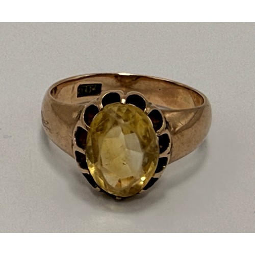  A citrine ring, the oval stone claw-set in a scalloped open-backed setting, to broad tapering should... 