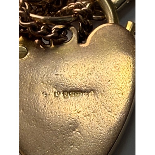 542 - A 9 carat rose gold textured fancy brick link bracelet, stamped '9CT' each end, with heart padlock c... 