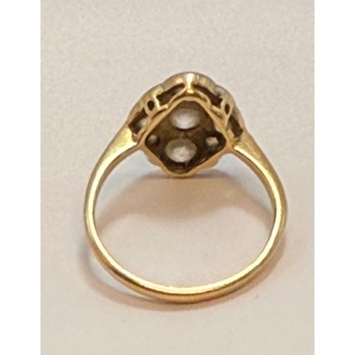 546 - A diamond cluster ring, five graduated old brilliant cut diamonds in a cross formation, with four ro... 