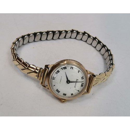  Two lady's gold expanding bracelet wristwatches, the first champagne circular dial with gilt metal A... 
