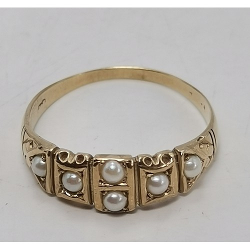 A 9 carat gold fancy pearl ring, the single pearl centred in an openwork twist mount, hallmarked Lon... 