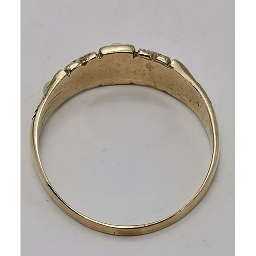  A 9 carat gold fancy pearl ring, the single pearl centred in an openwork twist mount, hallmarked Lon... 