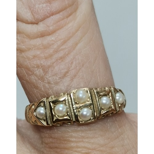  A 9 carat gold fancy pearl ring, the single pearl centred in an openwork twist mount, hallmarked Lon... 