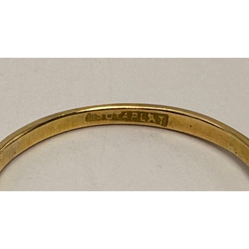 550 - A three-stone ring, set with graduated round white stones, stamped '18CT & PLAT' to shank. Ring size... 