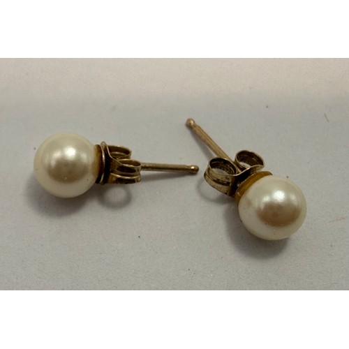 551 - Four pairs of assorted 9 carat gold pearl earrings, comprising a pair of studs, a pair of small pend... 