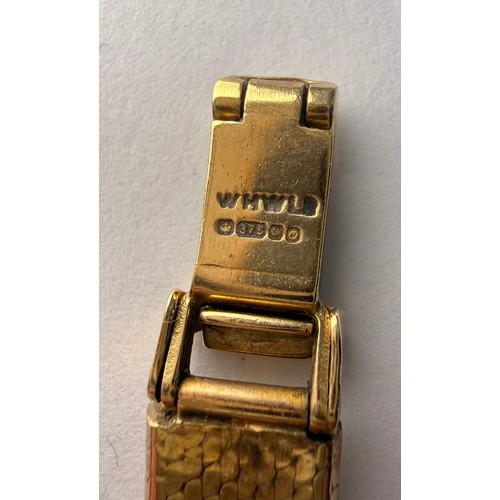 553 - A lady's 9 carat gold mesh bracelet watch, the white octagonal dial signed ROTARY QUARTZ, with black... 