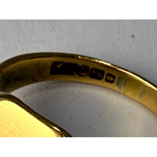 561 - An 18 carat gold signet ring, with plain cushion matrix, hallmarked Birmingham. Ring size O, 6.2g