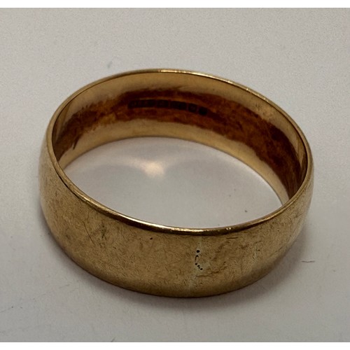  A broad 9 carat gold wedding band, hallmarked London 1981. Ring size W, 5.7g