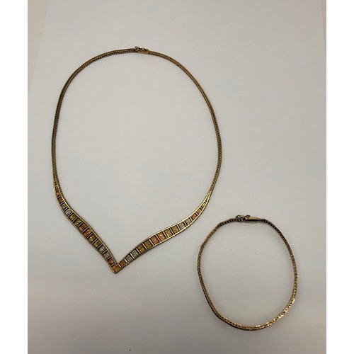 565 - A 9 carat tri-colour gold necklace and bracelet set, each a foxtail gold chain with beaded edges, se... 
