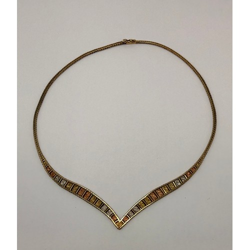 565 - A 9 carat tri-colour gold necklace and bracelet set, each a foxtail gold chain with beaded edges, se... 