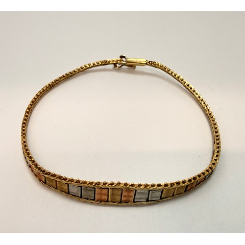 565 - A 9 carat tri-colour gold necklace and bracelet set, each a foxtail gold chain with beaded edges, se... 