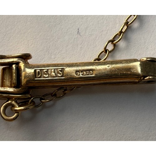  A lady's 9 carat gold fancy link bracelet watch, the square dial signed HELVETIA, with gilt metal Ar... 