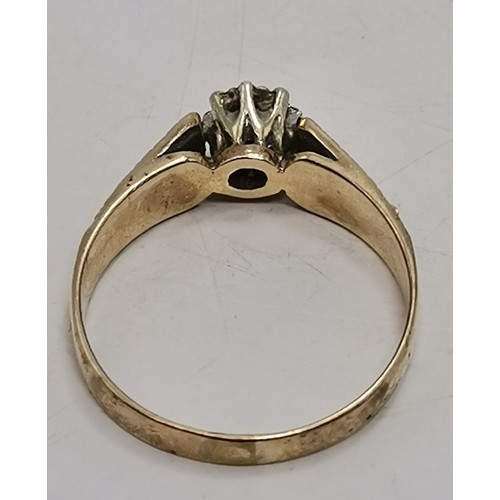  Two 9 carat gold white stone rings, the first a flowerhead cluster of graduated round stones in a ra... 
