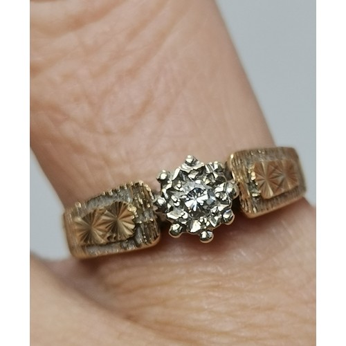  Two 9 carat gold white stone rings, the first a flowerhead cluster of graduated round stones in a ra... 