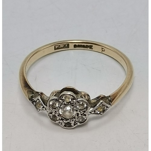  Two 9 carat gold white stone rings, the first a flowerhead cluster of graduated round stones in a ra... 
