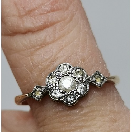  Two 9 carat gold white stone rings, the first a flowerhead cluster of graduated round stones in a ra... 