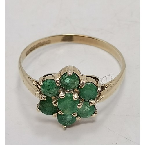 576 - Two 9 carat gold green gemstone rings, the first a flowerhead cluster, hallmarked 375, ring size R1/... 