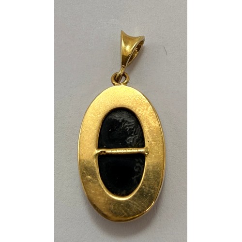  A black opal pendant, the oval stone collet set in gold, with open back, hallmarked (rubbed). 17mm (... 