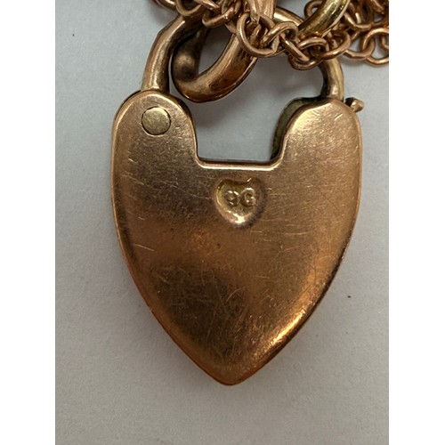 578 - A 9 carat rose gold fancy marina-style bracelet with heart padlock, each link stamped '9' and '.375'... 