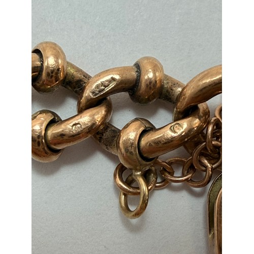 578 - A 9 carat rose gold fancy marina-style bracelet with heart padlock, each link stamped '9' and '.375'... 