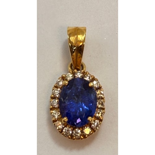  A Tanzanite and diamond cluster pendant, the claw-set oval blue-violet Tanzanite enclosed by a halo ... 