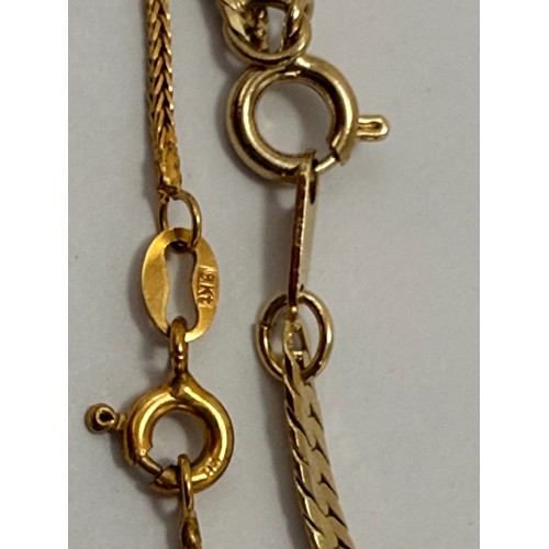 590 - A 9 carat gold hinge-opening bangle with carved leaf-style decoration to a banded ground, hallmarked... 