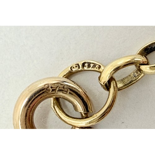  An Italian gold pendant, openwork elongated octagonal with white metal initial 'S' set with white st... 
