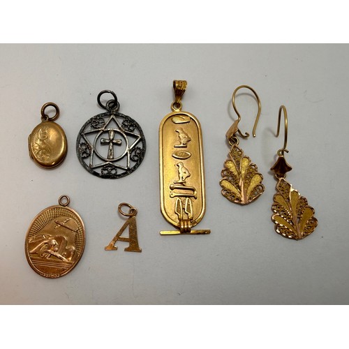  A group of miscellaneous gold and silver jewellery comprising a 9 carat gold double-sided St. Christ... 