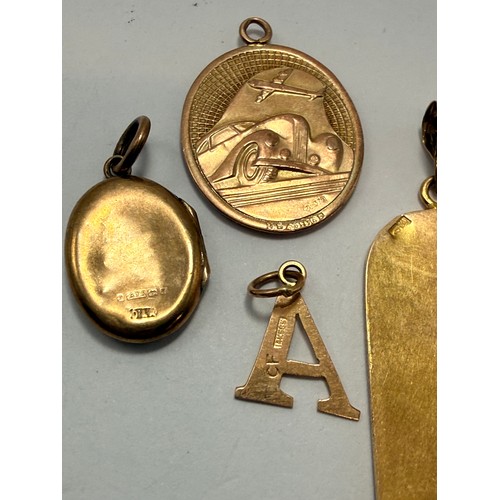  A group of miscellaneous gold and silver jewellery comprising a 9 carat gold double-sided St. Christ... 