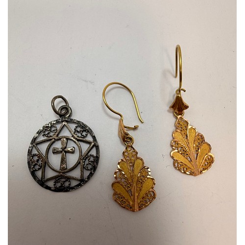  A group of miscellaneous gold and silver jewellery comprising a 9 carat gold double-sided St. Christ... 