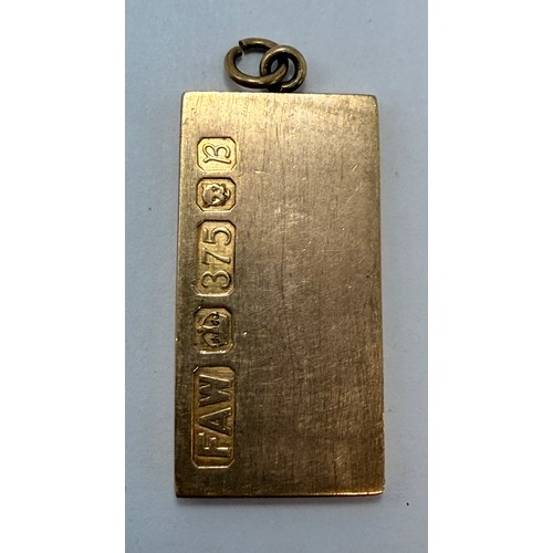 595 - A 9 carat gold ingot pendant, plain rectangular, hallmarked London 1976. 32mm (excl. loop) by 16mm, ... 