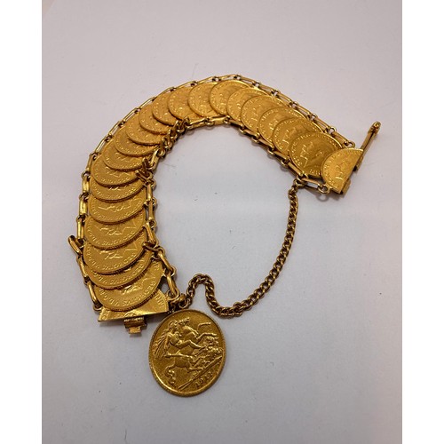 A yellow metal coin bracelet comprising twenty-two coins (one suspended on chain, one split in half for clasp) styled as half sovereigns, each dated 1911, unmarked. 97.9g gross

**Please note, we think it unlikely these coins are actual half sovereigns.  XRF tested off-site, the whole (coins and links) tests as 22 carat gold