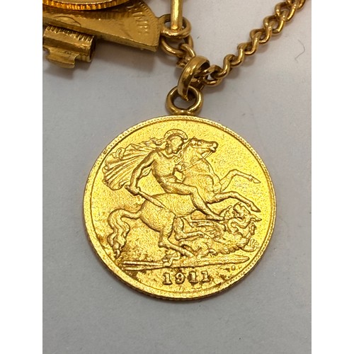  A yellow metal coin bracelet comprising twenty-two coins (one suspended on chain, one split in half ... 