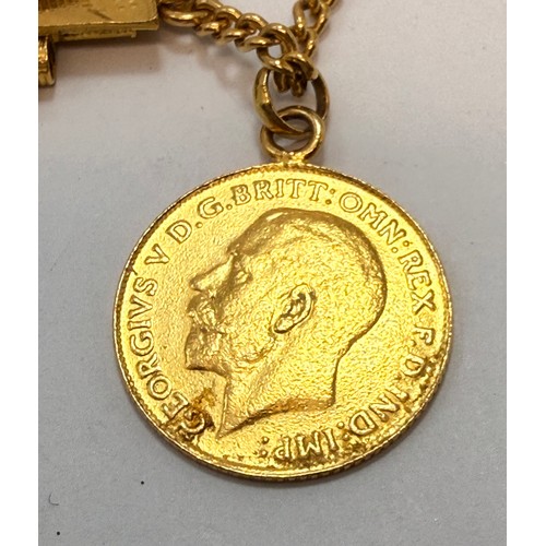  A yellow metal coin bracelet comprising twenty-two coins (one suspended on chain, one split in half ... 