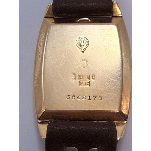  A 14 carat gold-cased wristwatch, c.1920s, the silvered cushion dial signed Sagit, with blue enamel ... 