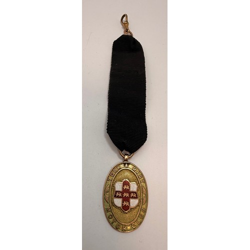  A 9 carat gold and enamelled fob medallion, oval, YORK & DIST MOTOR CLUB, engraved verso 'YORK - EDI... 
