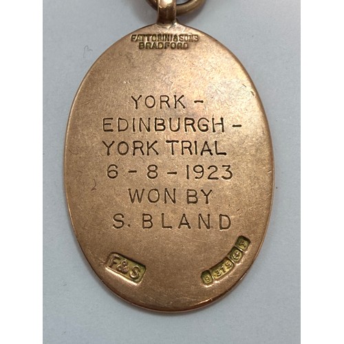  A 9 carat gold and enamelled fob medallion, oval, YORK & DIST MOTOR CLUB, engraved verso 'YORK - EDI... 