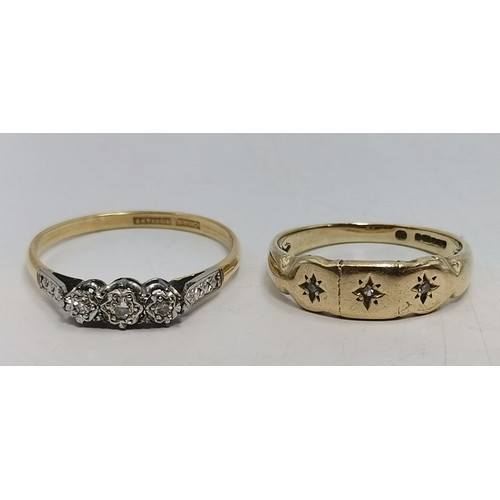  A three-stone ring, illusion-set with graduated round diamonds in a raised openwork mount with carve... 
