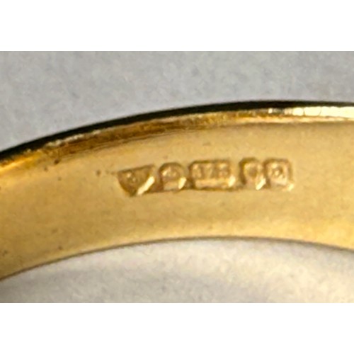  A 9 carat gold three-stone garnet ring, the broad tapering shank with a trio of graduated round ston... 